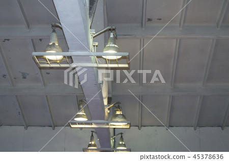 Lighting with lamps located on the ceiling in an industrial room Lighting with lamps located on the ceiling in an industrial room 45378636