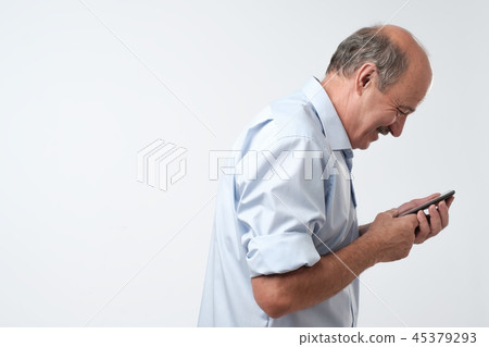 man reading sms on his phone man reading sms on his phone 45379293