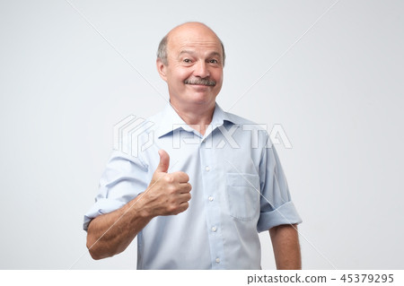bald man with his thumb up in sign of optimism bald man with his thumb up in sign of optimism 45379295