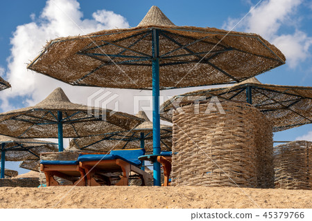 Deck Chairs and Straw Umbrellas - Red Sea Egypt Deck Chairs and Straw Umbrellas - Red Sea Egypt 45379766