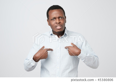 Young african man pointing at himself Young african man pointing at himself 45380806