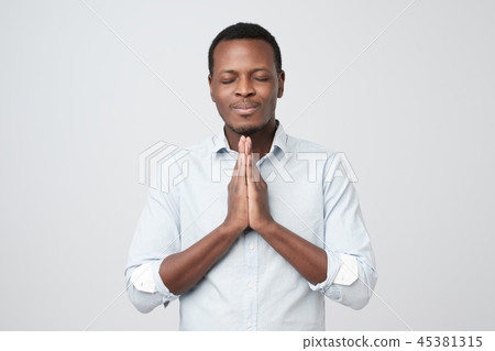 African young guy asking for a favor. 45381315