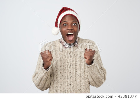 Funny christmas african man in red hat  45381377