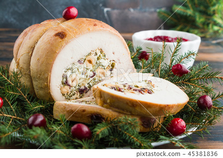 Baked turkey breast roll stuffed with feta cheese Baked turkey breast roll stuffed with feta cheese 45381836