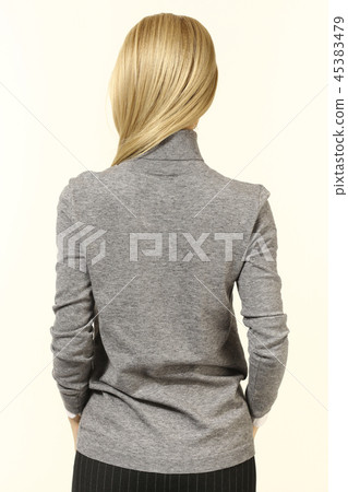 blond woman in printed long sleeve formal gray blouse rear view blond woman in printed long sleeve formal gray blouse rear view 45383479