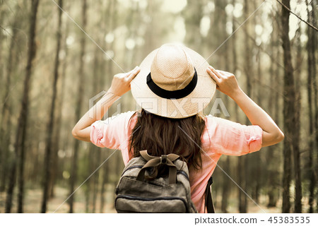 Young Asian backpacker tourist travel in the wild Young Asian backpacker tourist travel in the wild 45383535