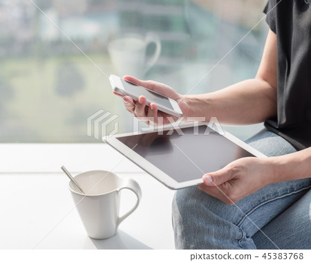 Business person using smart device working Business person using smart device working 45383768
