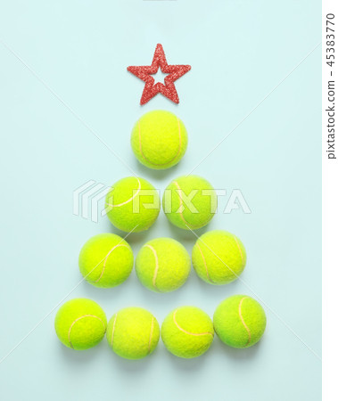 sport, fitness, game and objects concept - Christmas and New year concept with tennis balls top view sport, fitness, game and objects concept - Christmas and New year concept with tennis balls top view 45383770