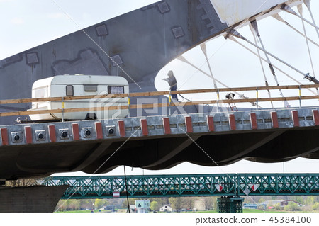 Man with helmet bridge construction seasonal job Man with helmet bridge construction seasonal job 45384100