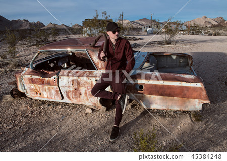 wearing sport clothes and holding metal pipe 45384248