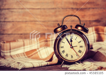Alarm clock and scarf. Alarm clock and scarf. 45385105