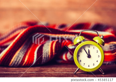 Alarm clock and scarf. 45385117