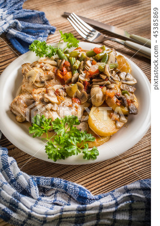 Fillet of chicken legs with stewed vegetables. Fillet of chicken legs with stewed vegetables. 45385869