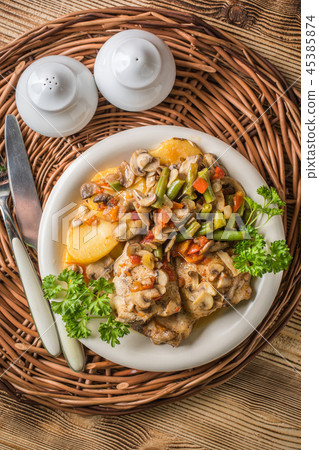 Fillet of chicken legs with stewed vegetables. Fillet of chicken legs with stewed vegetables. 45385874