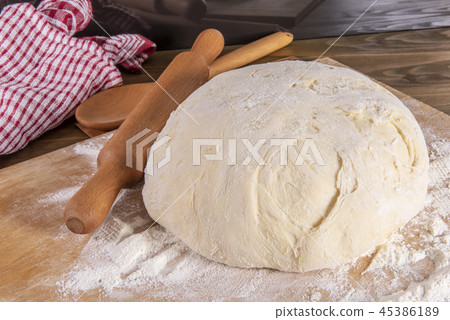 bread dough on a cutting board 45386189