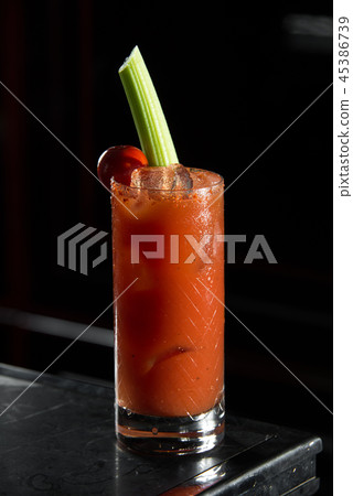 Bloody Mary on a bar desk. black background. Bloody Mary on a bar desk. black background. 45386739