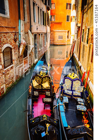 Venetian gondola in canal 45387164