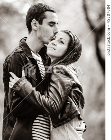 young couple in love in autumn season park 45387684