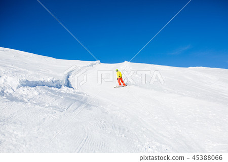 Photo from afar skier in snowy resort Photo from afar skier in snowy resort 45388066