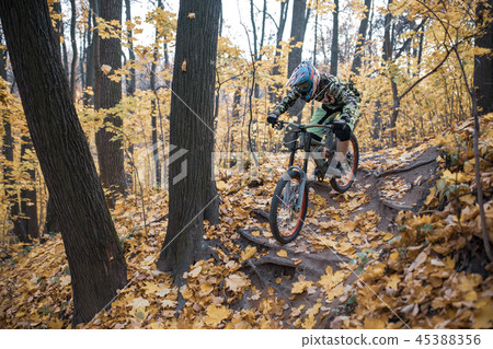 Photo of athlete in helmet riding sports bike on track Photo of athlete in helmet riding sports bike on track 45388356