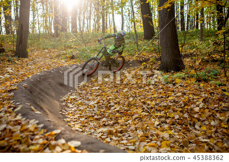 Photo of sports man riding on sports bike Photo of sports man riding on sports bike 45388362
