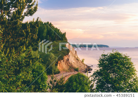 Sunrise light on cliff with pine wood Sunrise light on cliff with pine wood 45389151