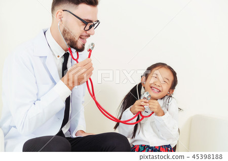 Happy little kid visit doctor in hospital office. 45398188
