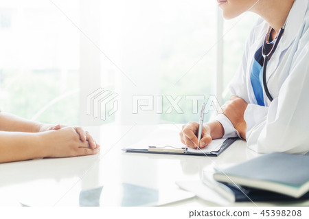Woman Doctor and Female Patient in Hospital Office 45398208