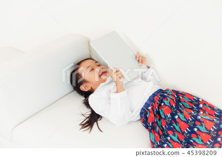 Little kid on white background with tablet. 45398209