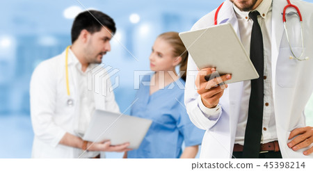 Doctor working in hospital with other doctors. Doctor working in hospital with other doctors. 45398214