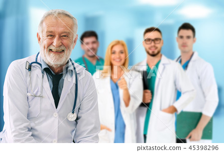 Doctor working in hospital with other doctors. 45398296