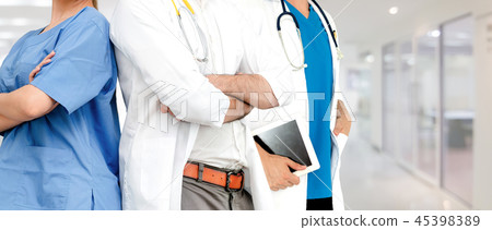 Doctor working in hospital with other doctors. 45398389