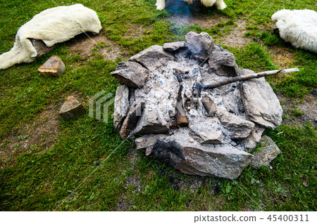 Camp fire made of stone ring, traditional, authentic 45400311