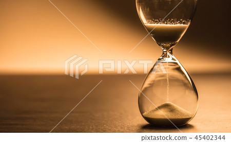 Modern hourglass in running time in studio lights 45402344
