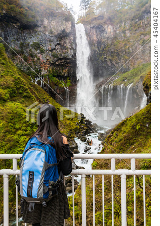 Young woman standing look of nature at Kegon fall. Young woman standing look of nature at Kegon fall. 45404167