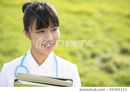Nurse with files in the meadow Nurse with files in the meadow 45405313