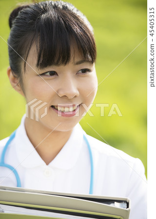 Nurse with files in the meadow Nurse with files in the meadow 45405315
