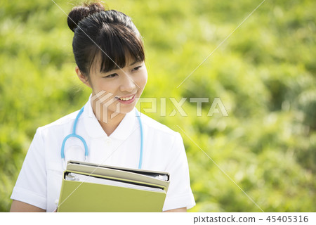 Nurse with files in the meadow Nurse with files in the meadow 45405316