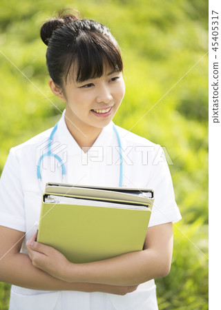Nurse with files in the meadow Nurse with files in the meadow 45405317