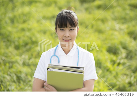 Nurse with files in the meadow Nurse with files in the meadow 45405319