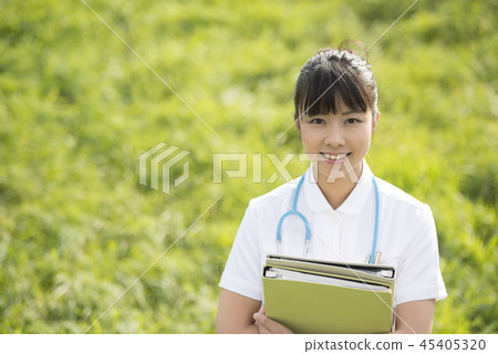 Nurse with files in the meadow Nurse with files in the meadow 45405320