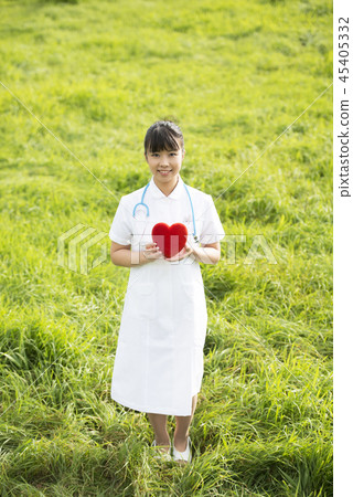 Nurse with a heart in the meadow 45405332