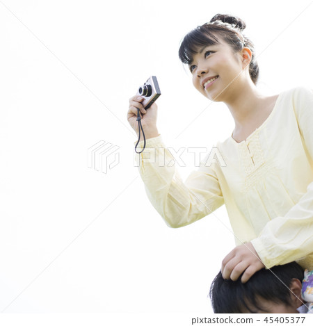 A woman holding a camera 45405377