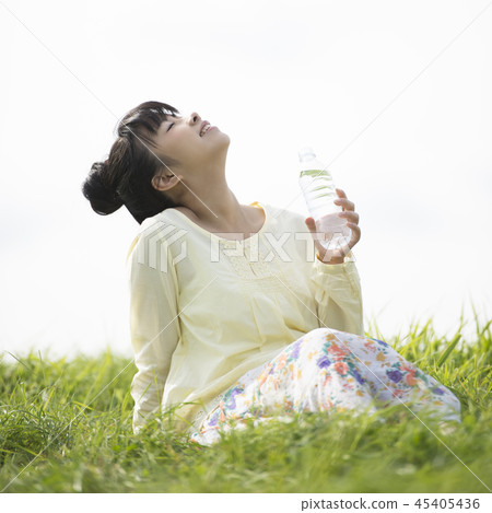 Woman hydration in the meadow Woman hydration in the meadow 45405436