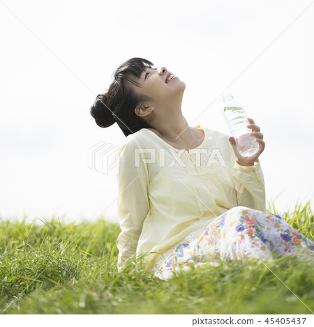 Woman hydration in the meadow Woman hydration in the meadow 45405437