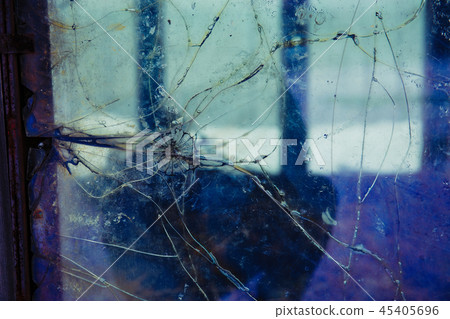 Cracked and broken window, Industrial background Cracked and broken window, Industrial background 45405696