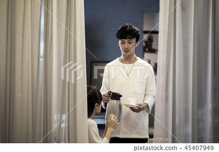 A man and a woman in a cafe 45407949