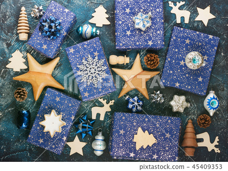 Presents in blue wrapping paper on table Presents in blue wrapping paper on table 45409353