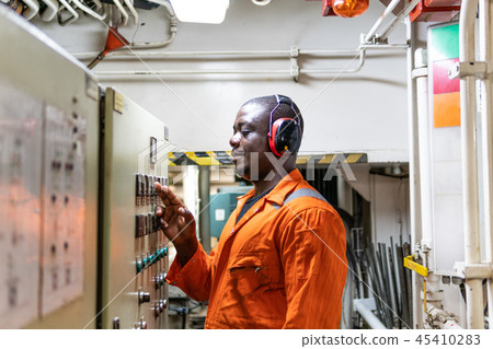 Marine engineer officer working in engine room 45410283