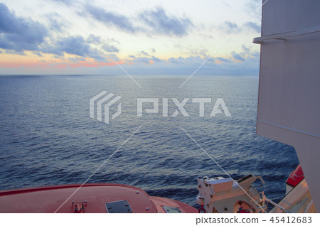 Sunset on the Mediterranean sea, a beautiful view from the cruise ship, visible lifeboats Sunset on the Mediterranean sea, a beautiful view from the cruise ship, visible lifeboats 45412683